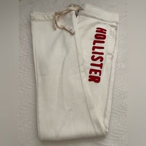 Hollister Men’s Off-White Irregularb Sweatpants with Red Lettering